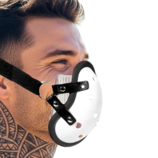 Image of male with neck tattoos, with face strap in shape of groin cup.