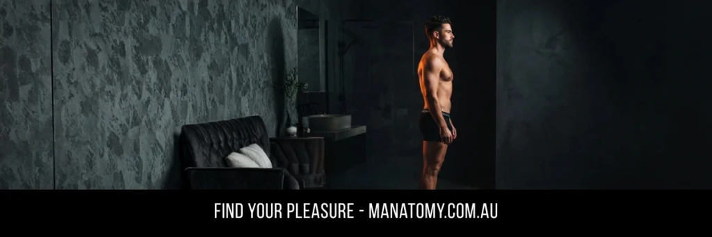 A man seen side-on in a dark room with a textured stone wall, above a Find Your Pleasure banner.