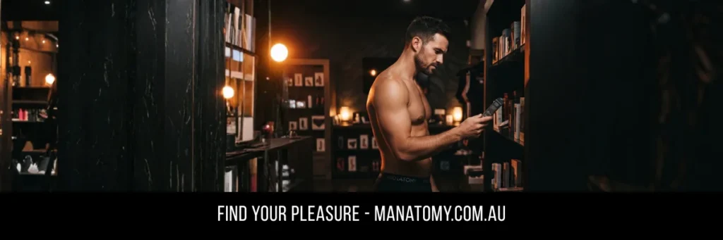 A man browsing a dimly lit wall of shelves, holding a small item, above a Find Your Pleasure banner.