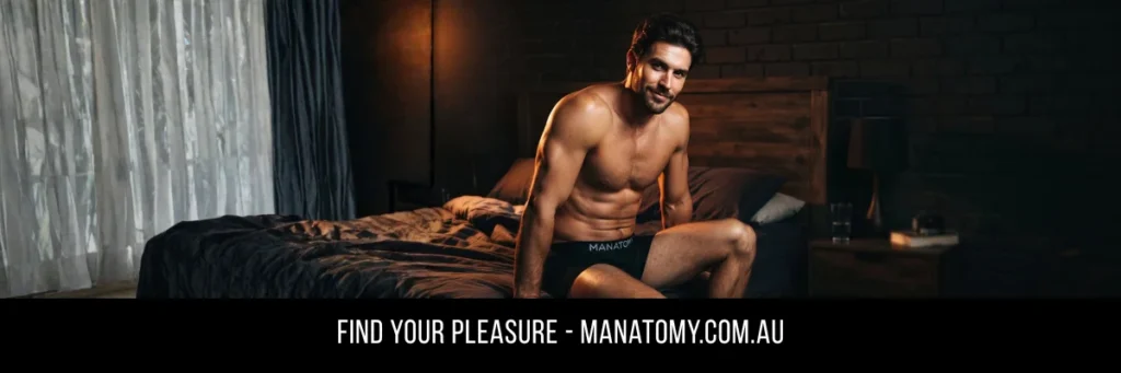 A man sitting on the edge of a dark bed by a sheer-curtained window, above a Find Your Pleasure banner.