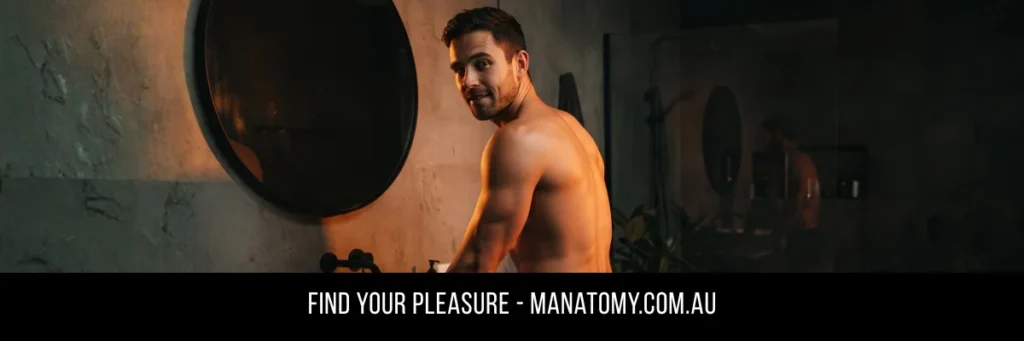 A man glancing over his shoulder beside a round mirror in a dim bathroom, above a Find Your Pleasure banner.